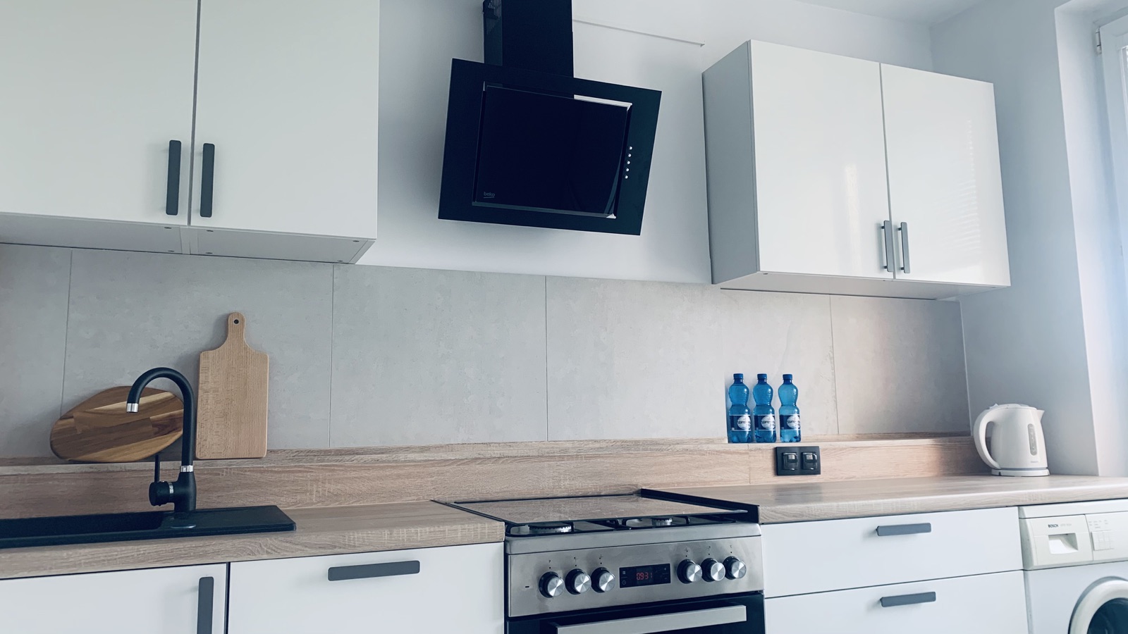 Kitchen counters, hob and oven in the shared Borowska apartment kitchen